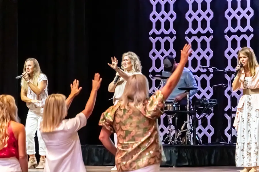 Worship on stage at the More Than Enough Women's Conference